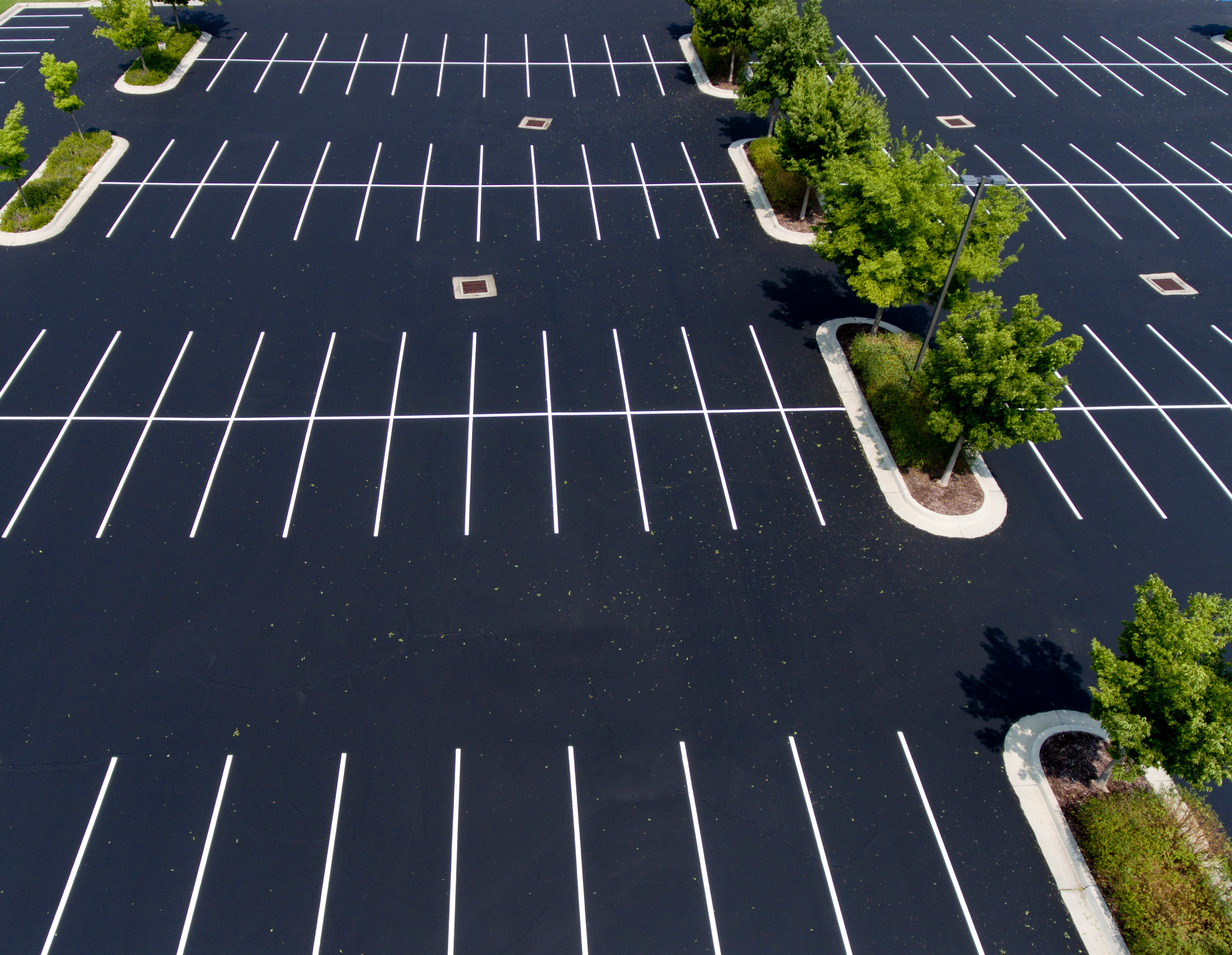 New parking lot layout striped over fresh sealcoat